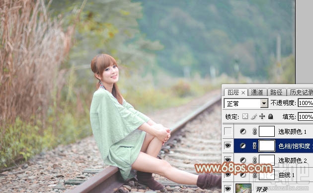 如何用Photoshop CC打造甜美的淡调青绿色铁轨美女图片